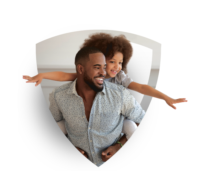 Father carrying his young daughter on his back as she pretends to fly.